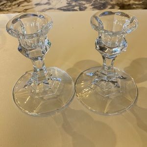 two glass candle stick holders, approximately 4 inches tall, 3 inches wide base